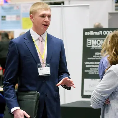 a student interacts with an employer at the career fair